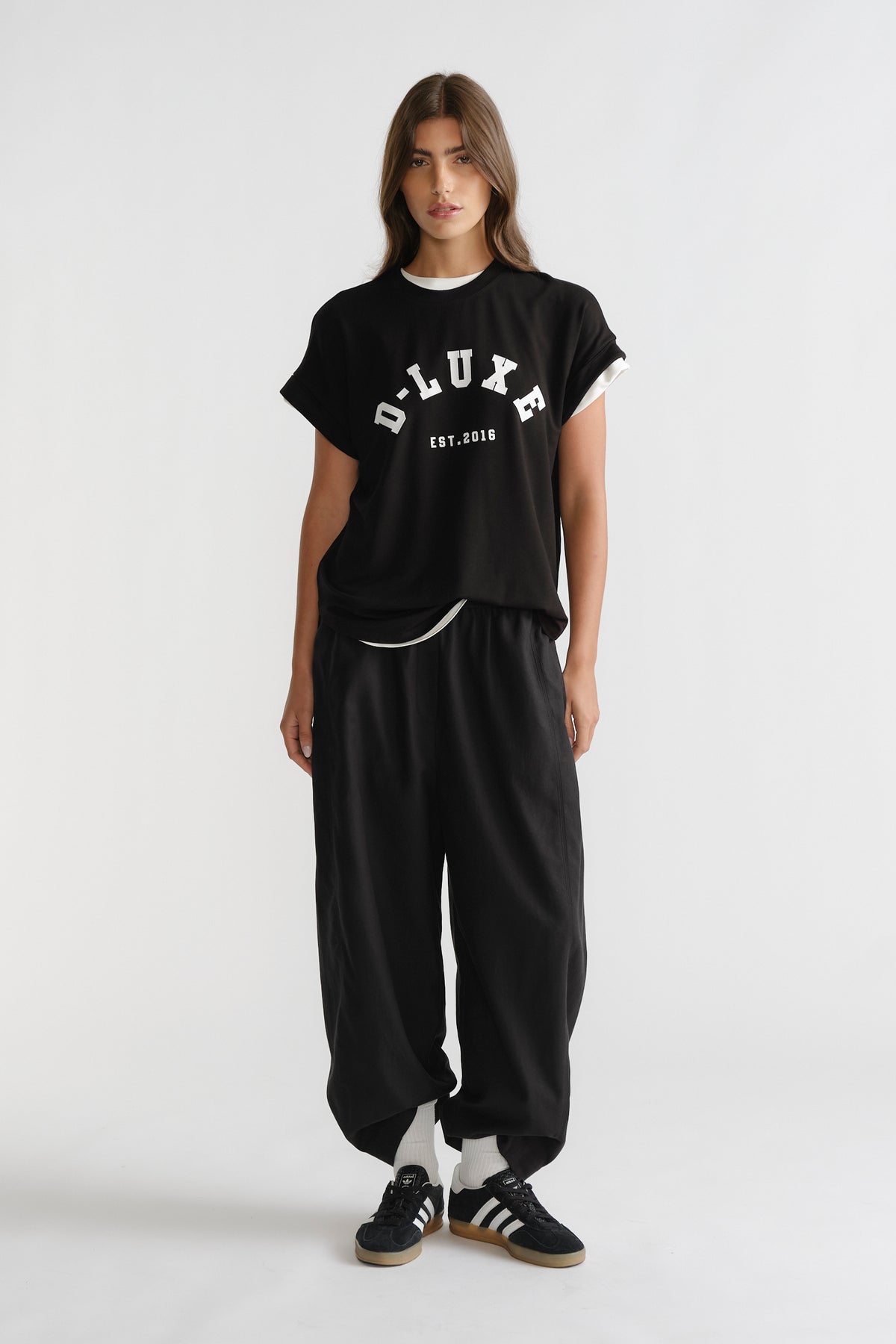 D-Luxe Half Moon Tee in black with white contrast trim worn casually, a versatile style by DECJUBA Australian fashion brand.