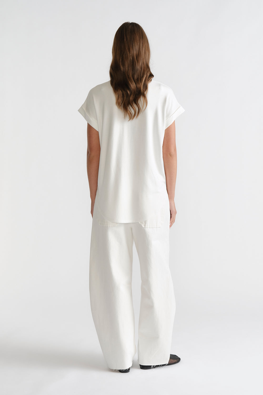 D-Luxe Half Moon Tee in white with a relaxed fit, styled with wide-leg white denim by DECJUBA Australian fashion brand