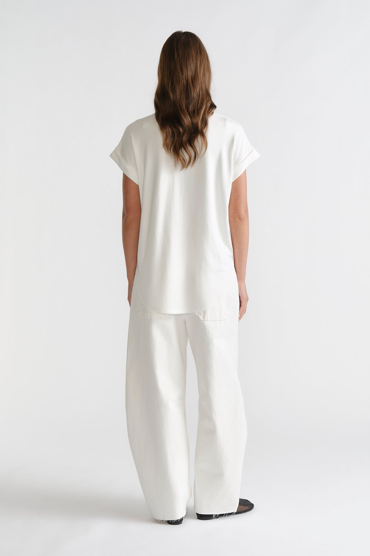 D-Luxe Half Moon Tee in white with a relaxed fit, styled with wide-leg white denim by DECJUBA Australian fashion brand