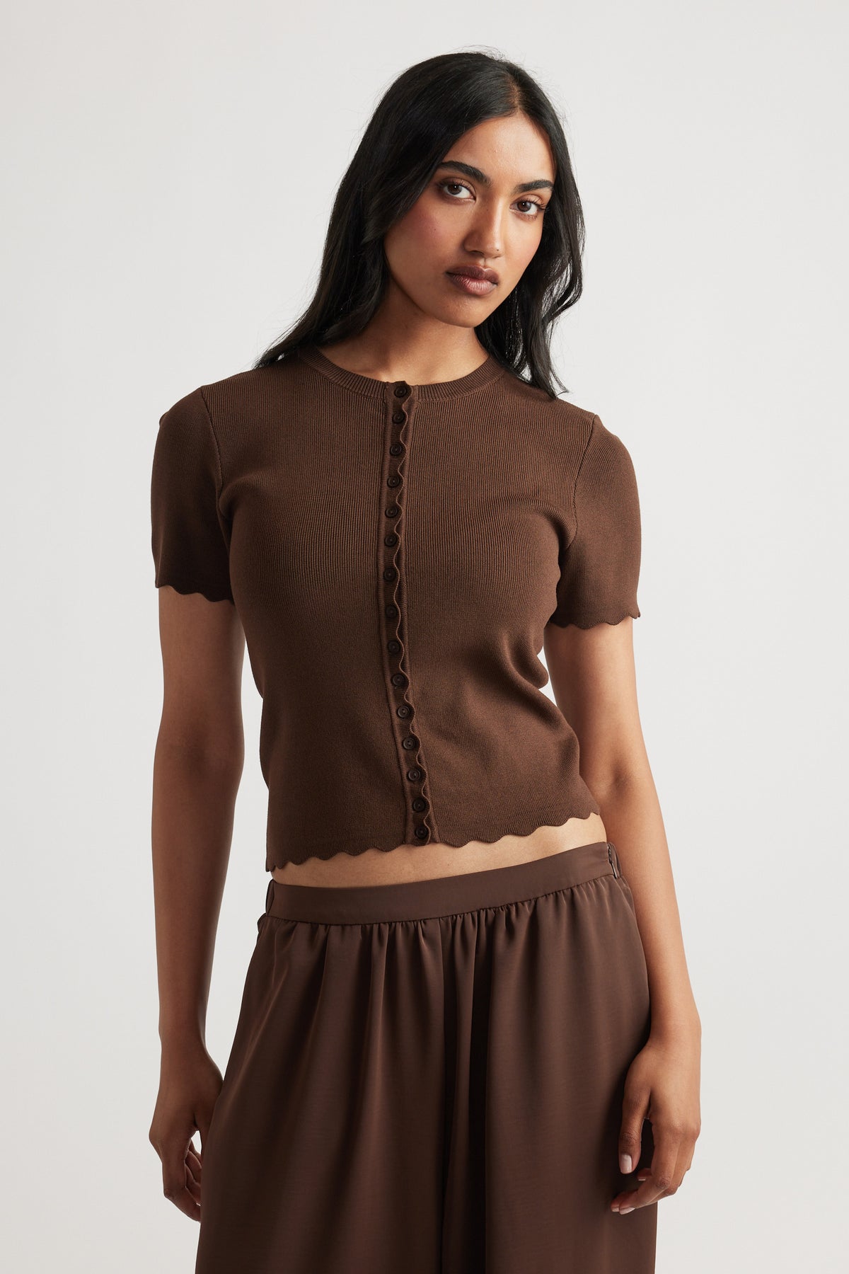 Maya Scallop Trim Button Top in rich coffee brown with short sleeves and delicate scalloped edges for a refined look.