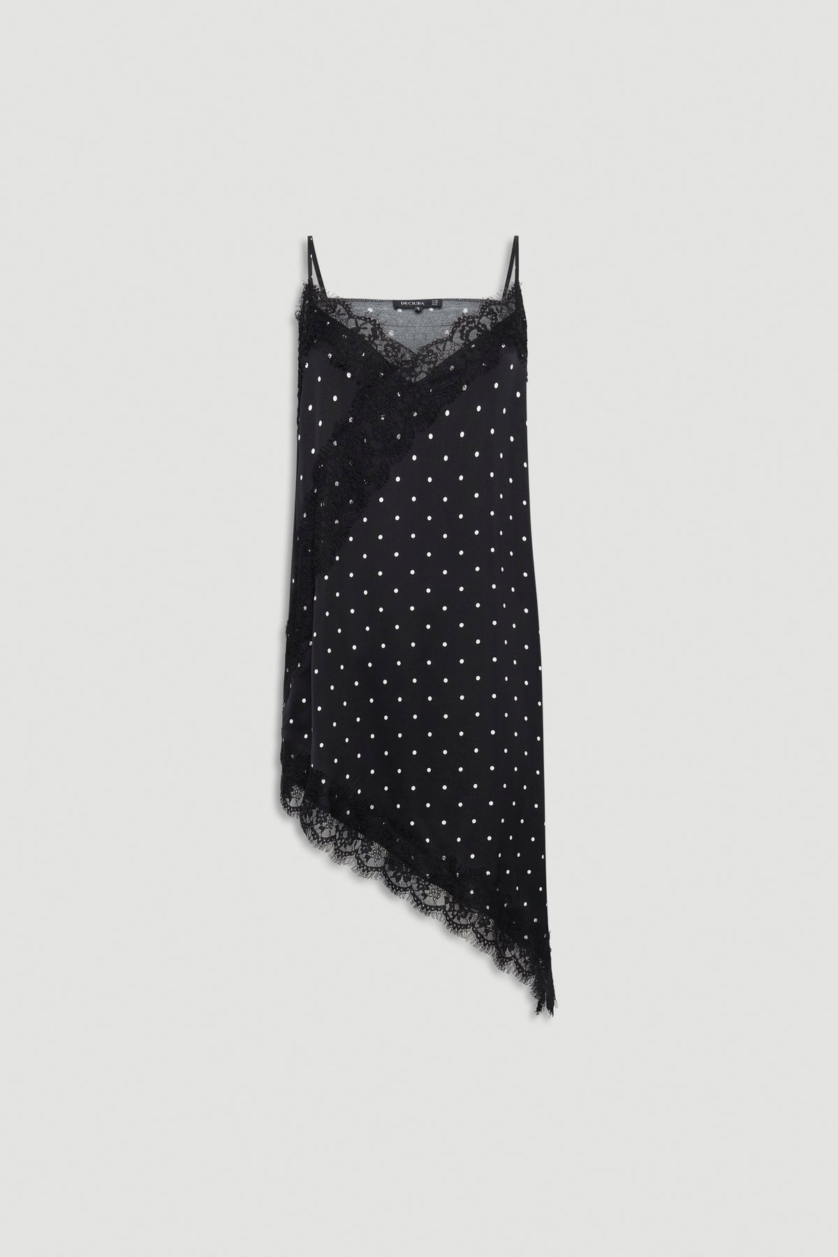 Black asymmetric tunic with white polka dots, delicate lace trim, thin adjustable straps, and soft textured fabric