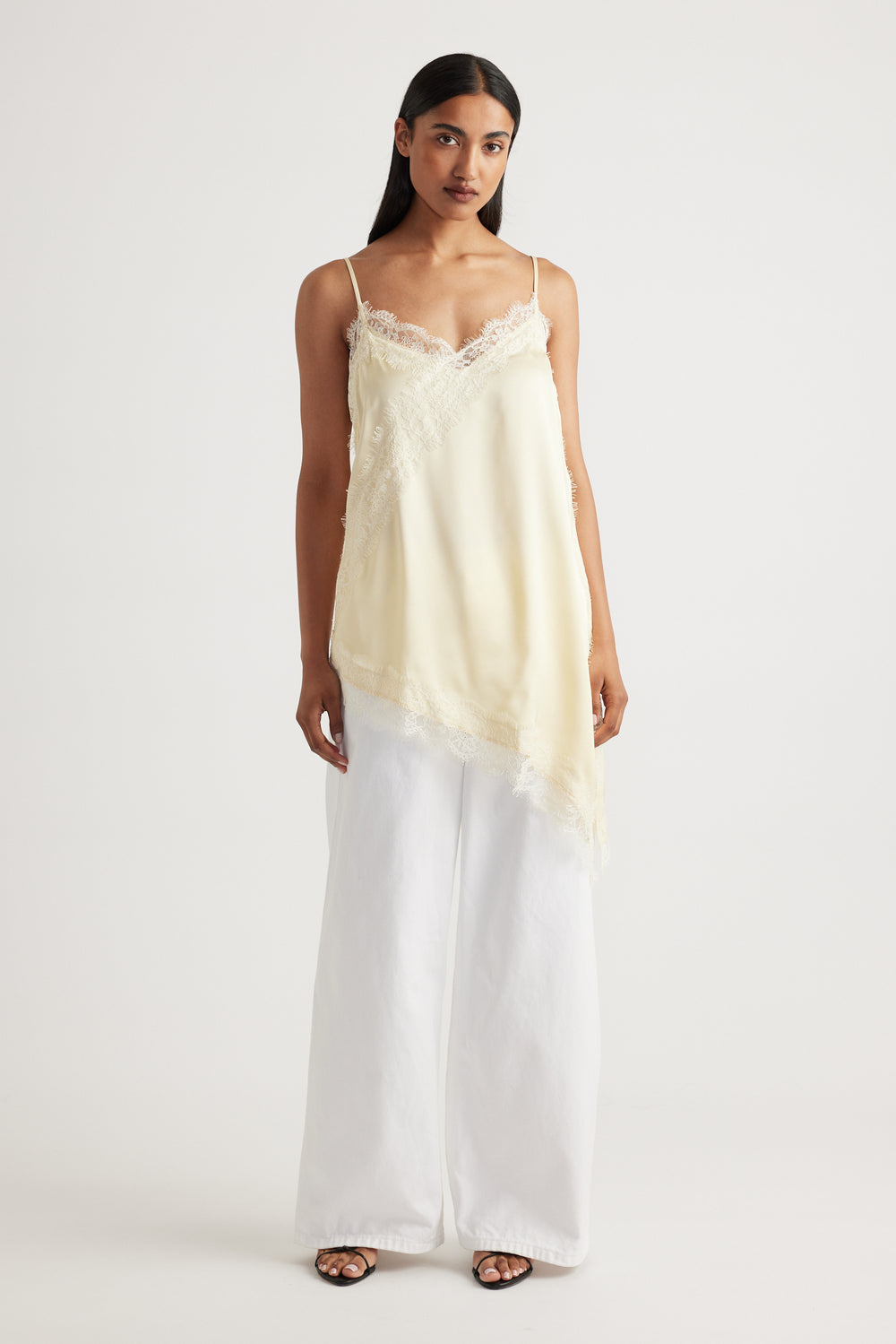 Woman wearing Karla Lace Tunic in cream with delicate lace trim, made from 100% viscose and nylon by DECJUBA Australian brand