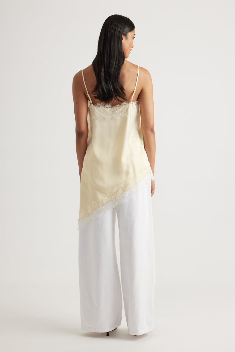 Back view of woman wearing Karla Lace Tunic in soft cream with lace trim, made from 100% viscose by DECJUBA Australian brand