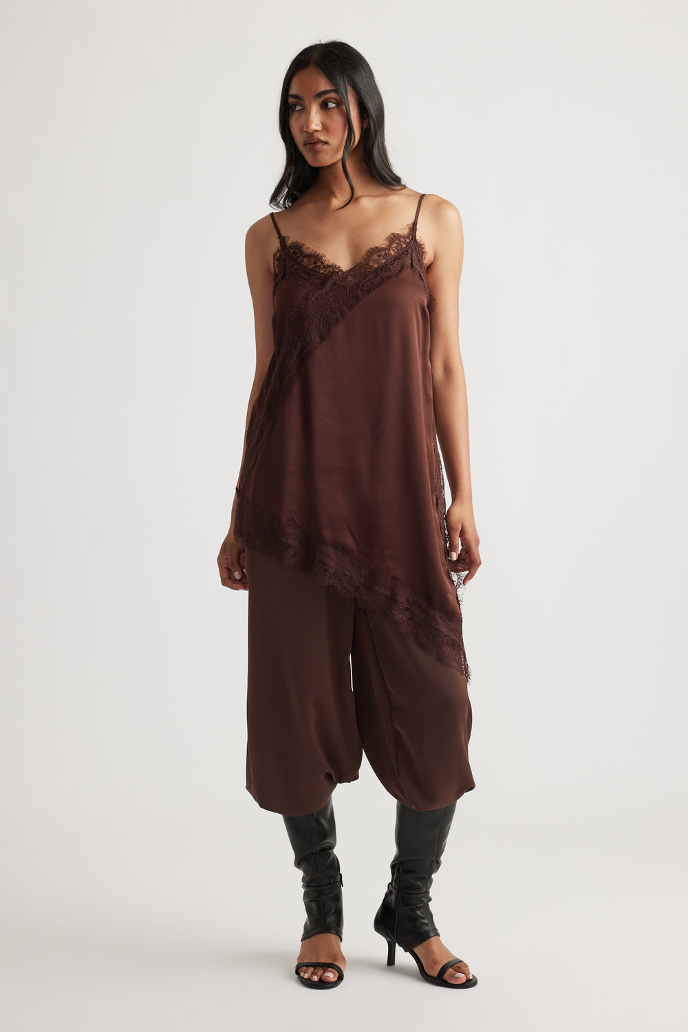 Woman modeling Karla Lace Tunic in deep brown with asymmetrical lace details by DECJUBA Australian fashion brand