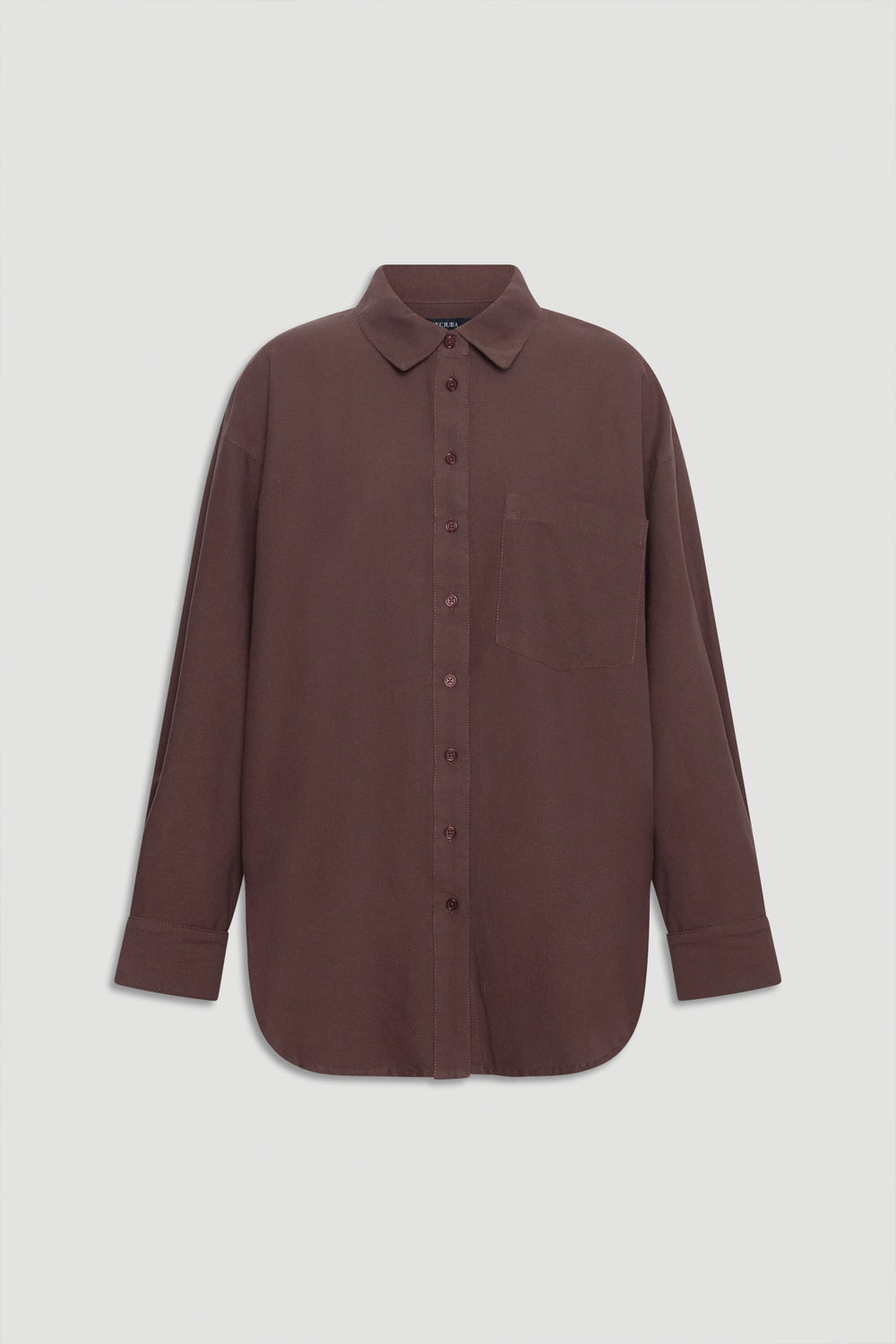 Oversized oxford shirt in muted brown with classic collar, front buttons, chest pocket, and long cuffed sleeves