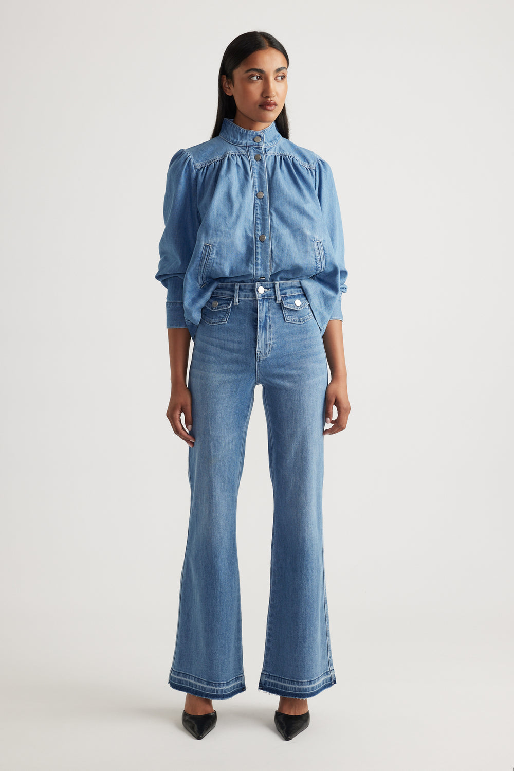 Bea Flare Jean in mid-blue denim with high-rise waist and flared leg worn with matching denim top by DECJUBA Australian brand