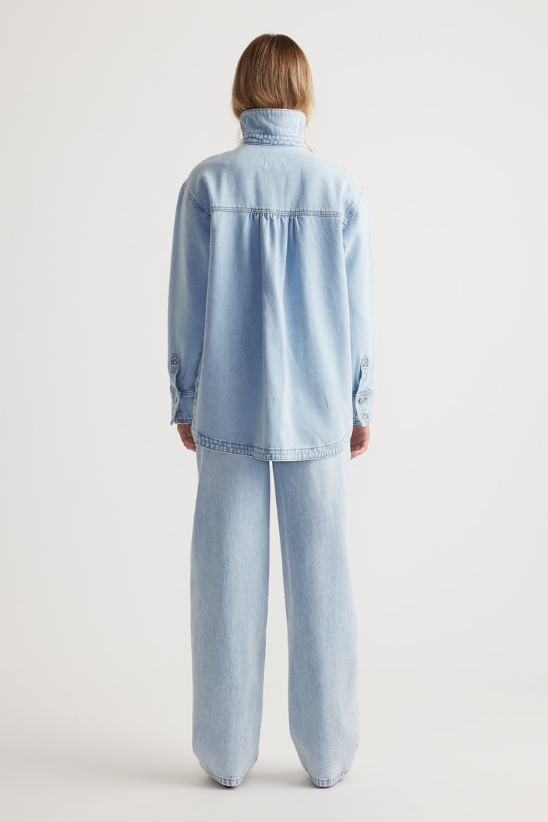Ariana Denim Shirt in soft light blue denim with high collar and relaxed fit by DECJUBA Australian fashion brand