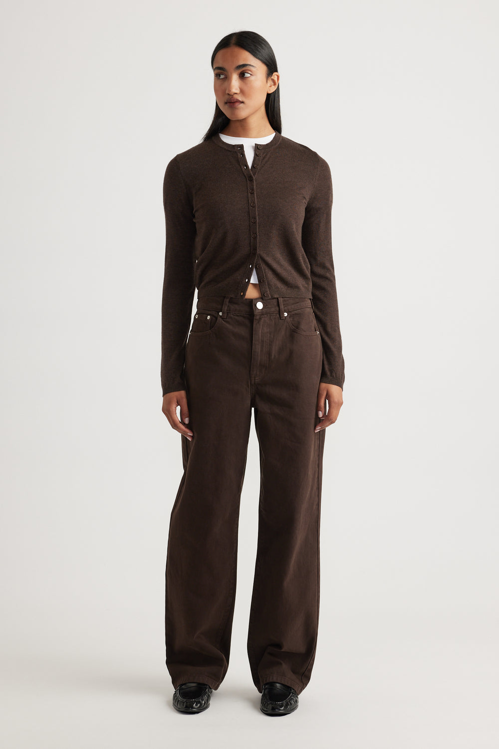 Woman wearing Bella Button Through Cardigan in rich chocolate brown with long sleeves and round neckline by DECJUBA.