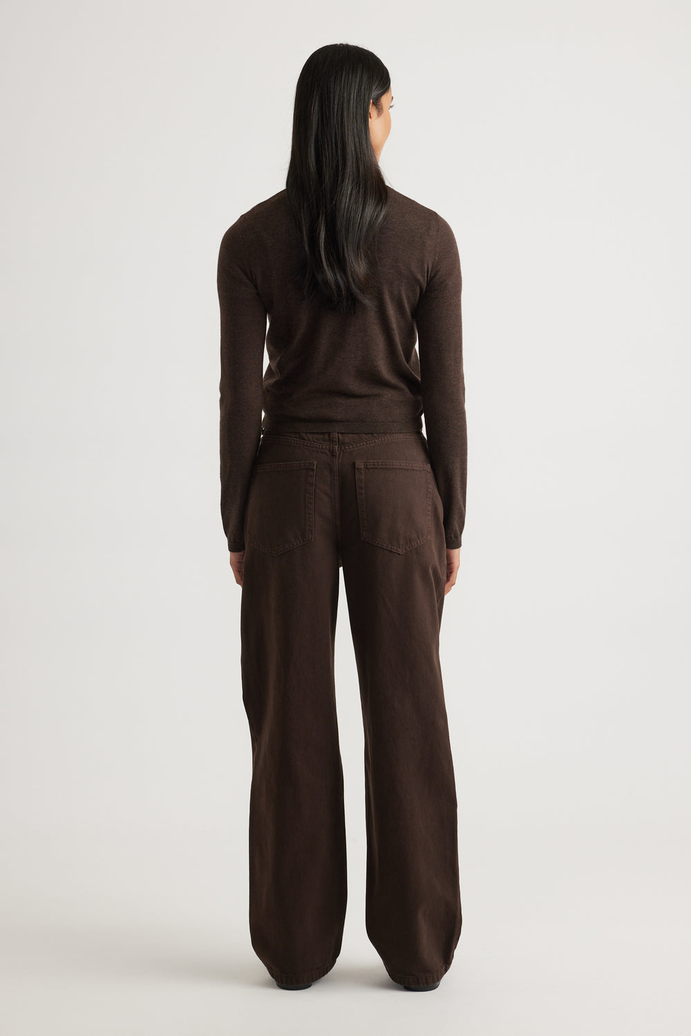 Woman wearing Bella Button Through Cardigan in rich chocolate brown, styled with matching wide-leg pants by DECJUBA.
