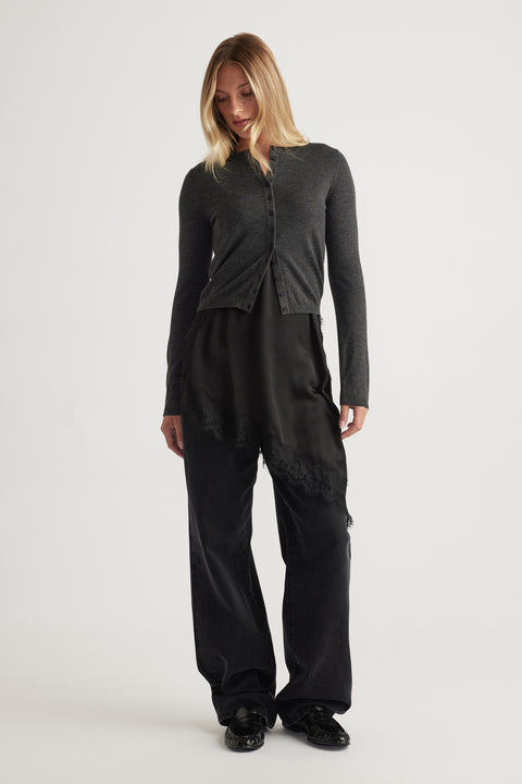 Woman wearing Bella Button Through Cardigan in charcoal grey with fitted silhouette and button details by DECJUBA