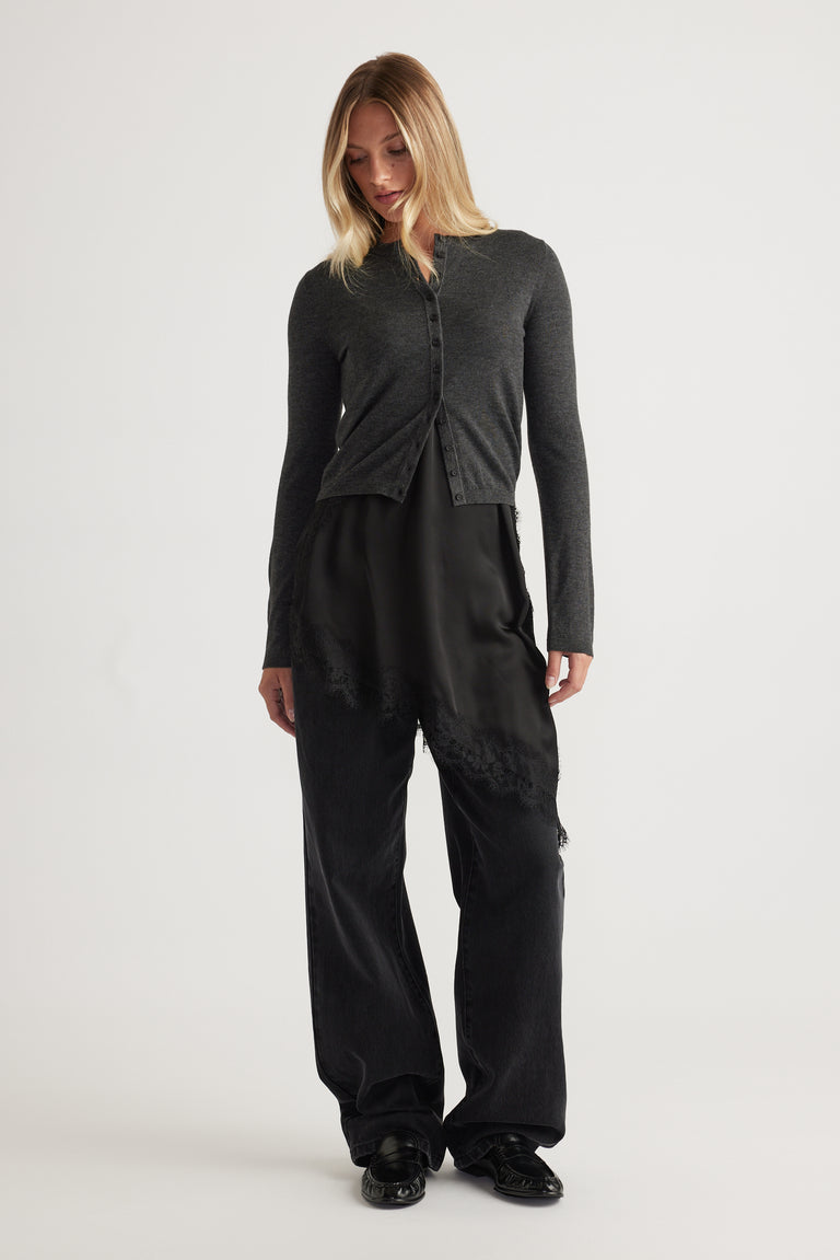 Woman wearing Bella Button Through Cardigan in charcoal grey with fitted silhouette and button details by DECJUBA