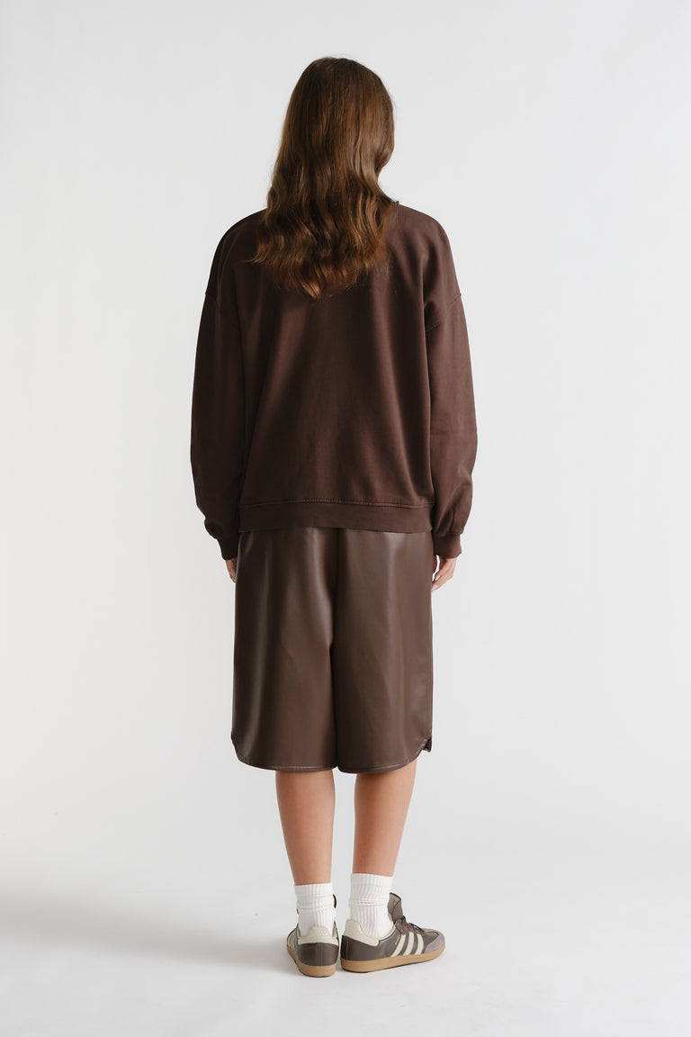 Person wearing D-Luxe Washed Terry Sweat in rich walnut brown with relaxed fit and casual style for effortless comfort.