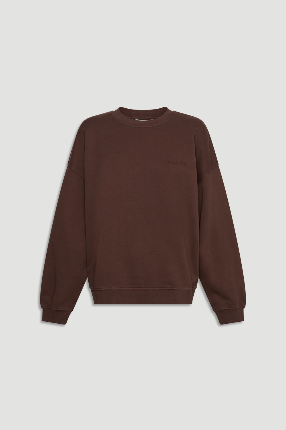 D-Luxe Washed Terry Sweat in rich walnut brown with relaxed fit and ribbed cuffs for a cozy, stylish everyday layer by DECJUBA.