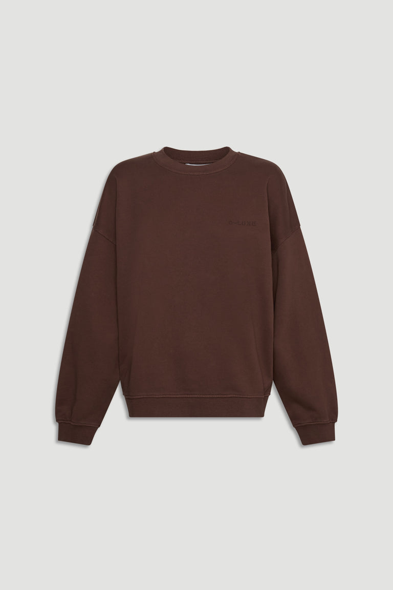 D-Luxe Washed Terry Sweat in rich walnut brown with relaxed fit and ribbed cuffs for a cozy, stylish everyday layer by DECJUBA.