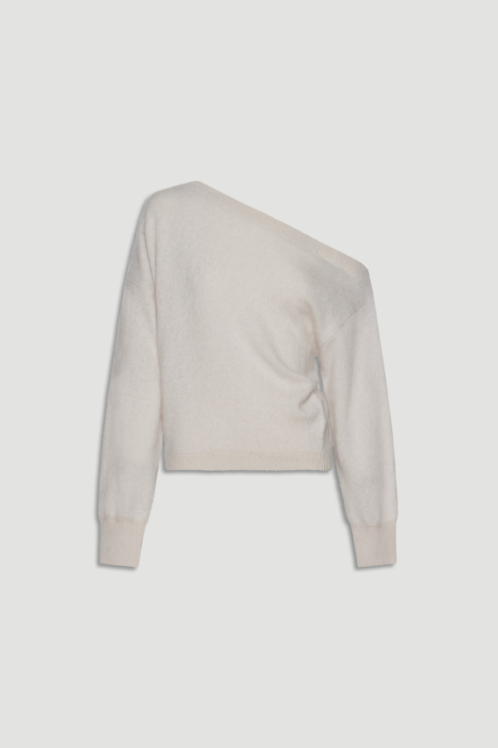 Soft cream wool jumper with an asymmetrical drop shoulder design offering cozy, relaxed elegance.