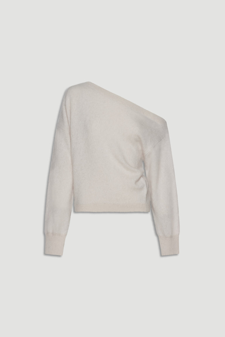 Soft cream wool jumper with an asymmetrical drop shoulder design offering cozy, relaxed elegance.
