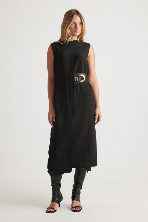 Woman wearing Isla Overlay Midi Dress in black sleeveless design with belted waist and asymmetrical hem by DECJUBA