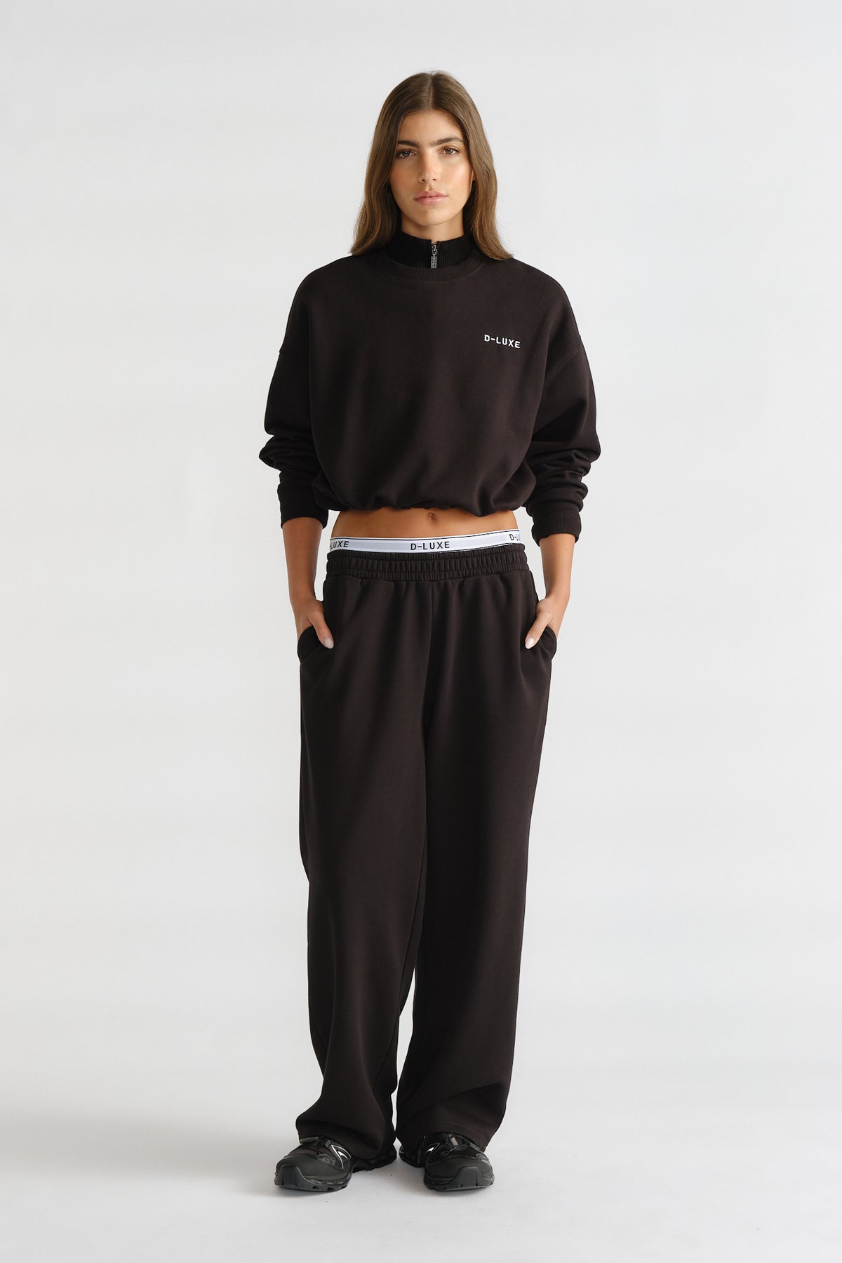 D-Luxe Logo Crop Sweat in black with a relaxed fit, paired with matching loose pants for comfy casual style by DECJUBA