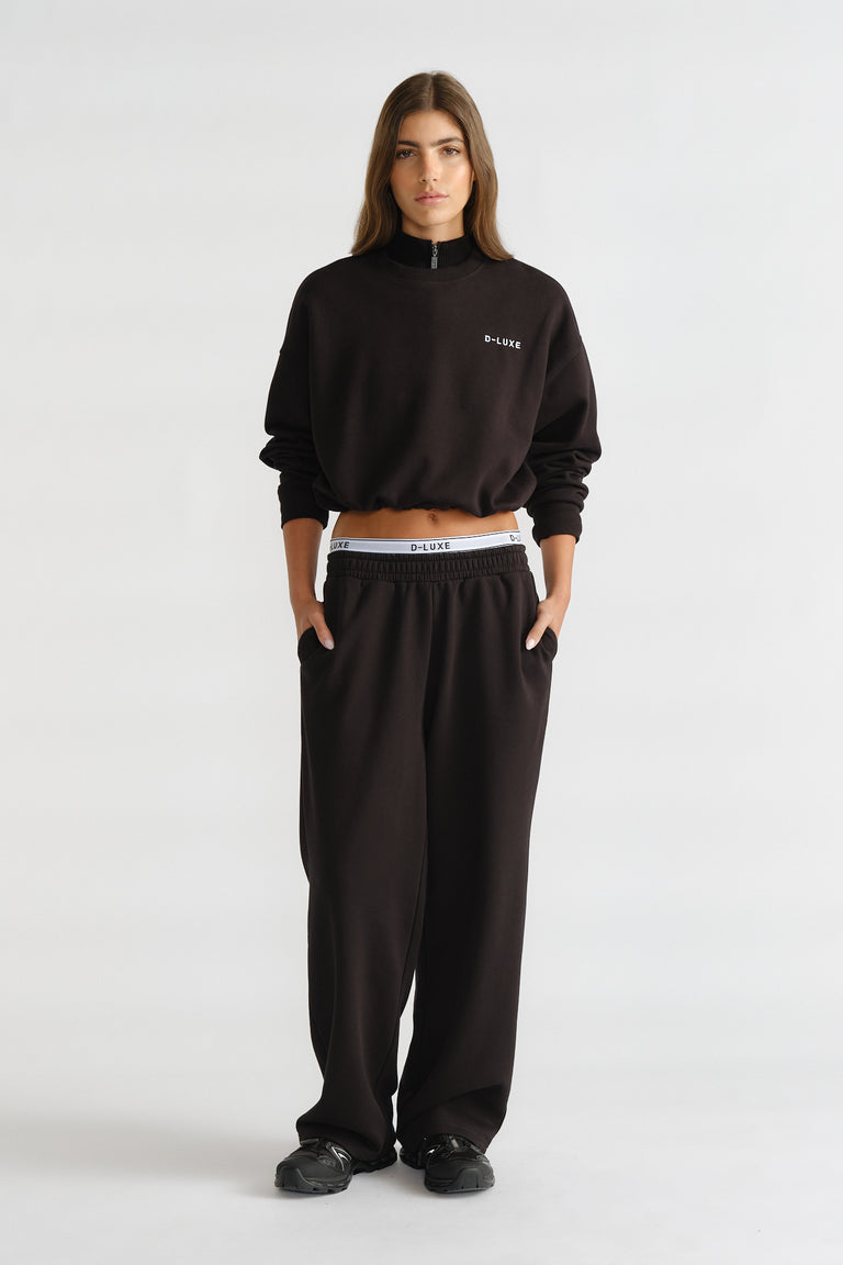 D-Luxe Logo Crop Sweat in black with a relaxed fit, paired with matching loose pants for comfy casual style by DECJUBA