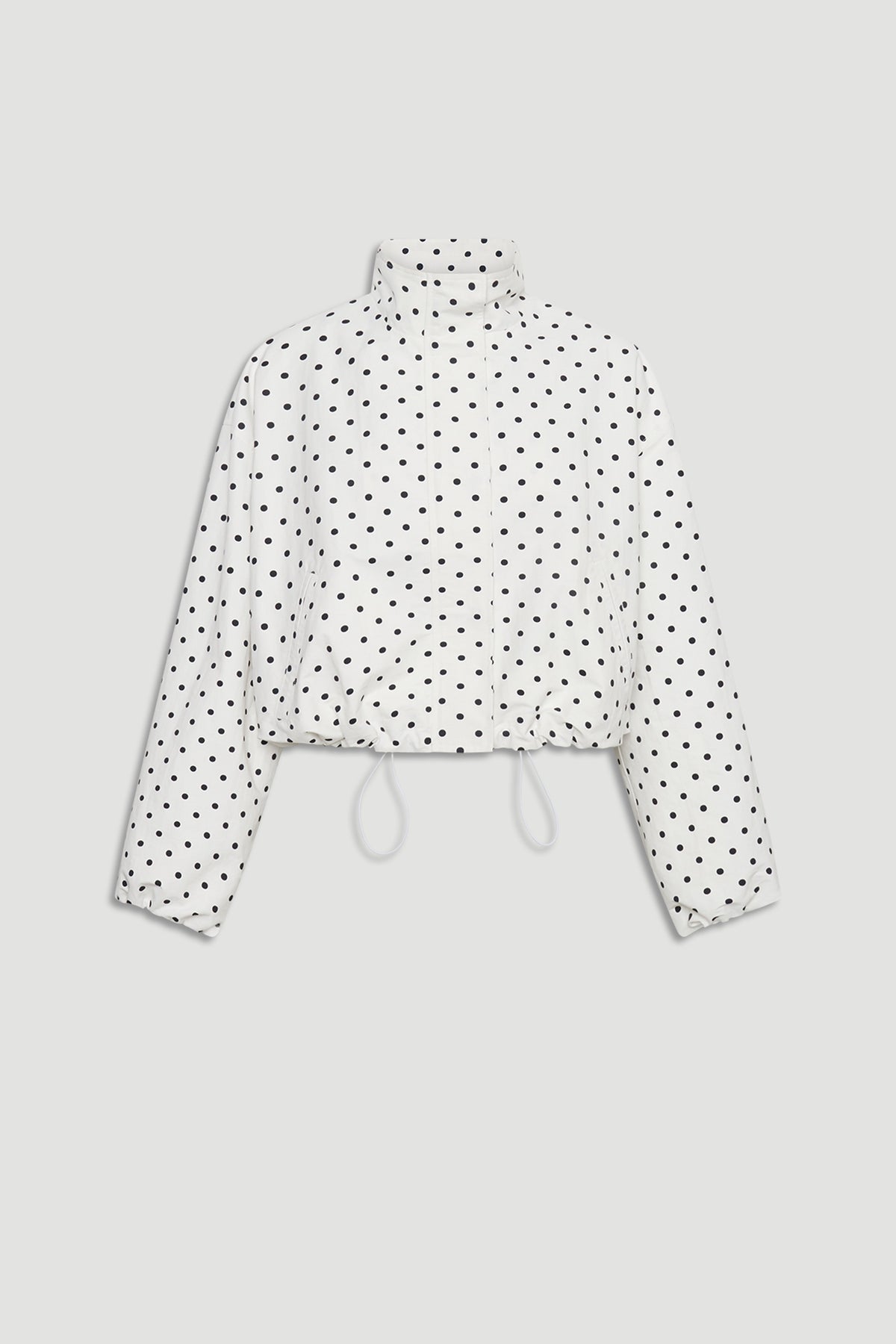 D-Luxe Polka Dot Jacket in white with black dots, featuring a high neck and adjustable drawstring hem by DECJUBA Australian fashion brand