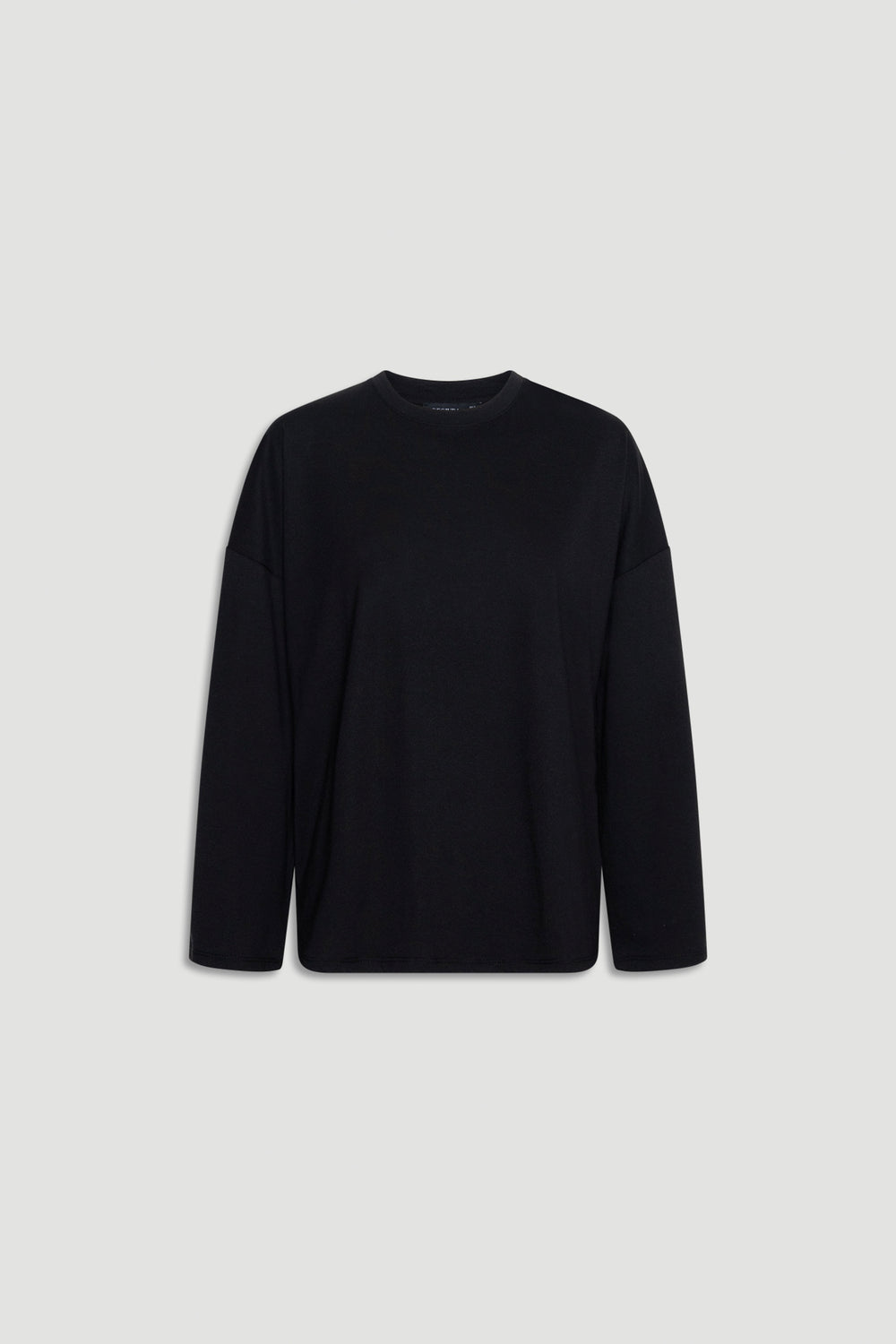 Minimalist black long sleeve top with a relaxed fit and subtle crew neckline for versatile everyday wear