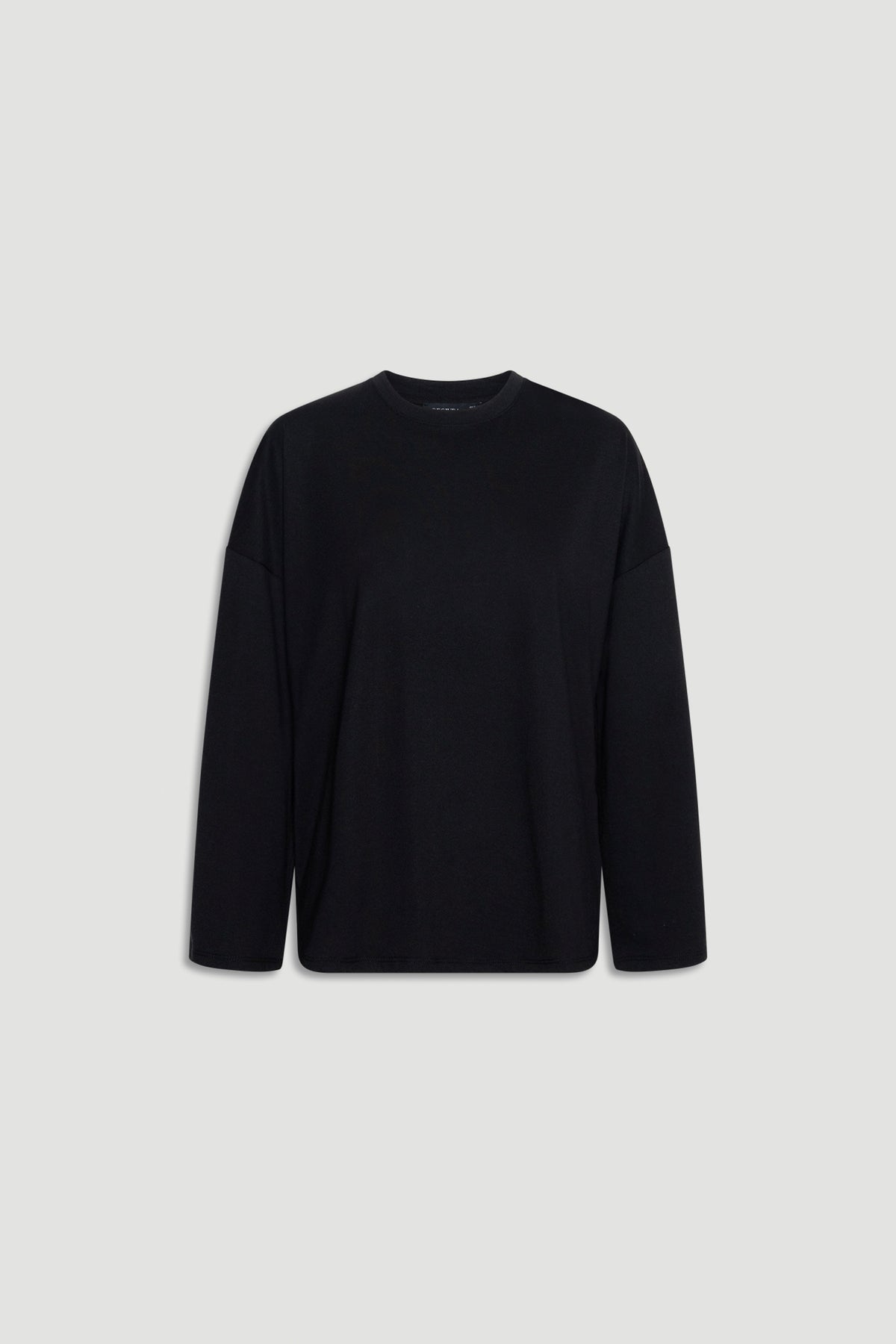Minimalist black long sleeve top with a relaxed fit and subtle crew neckline for versatile everyday wear