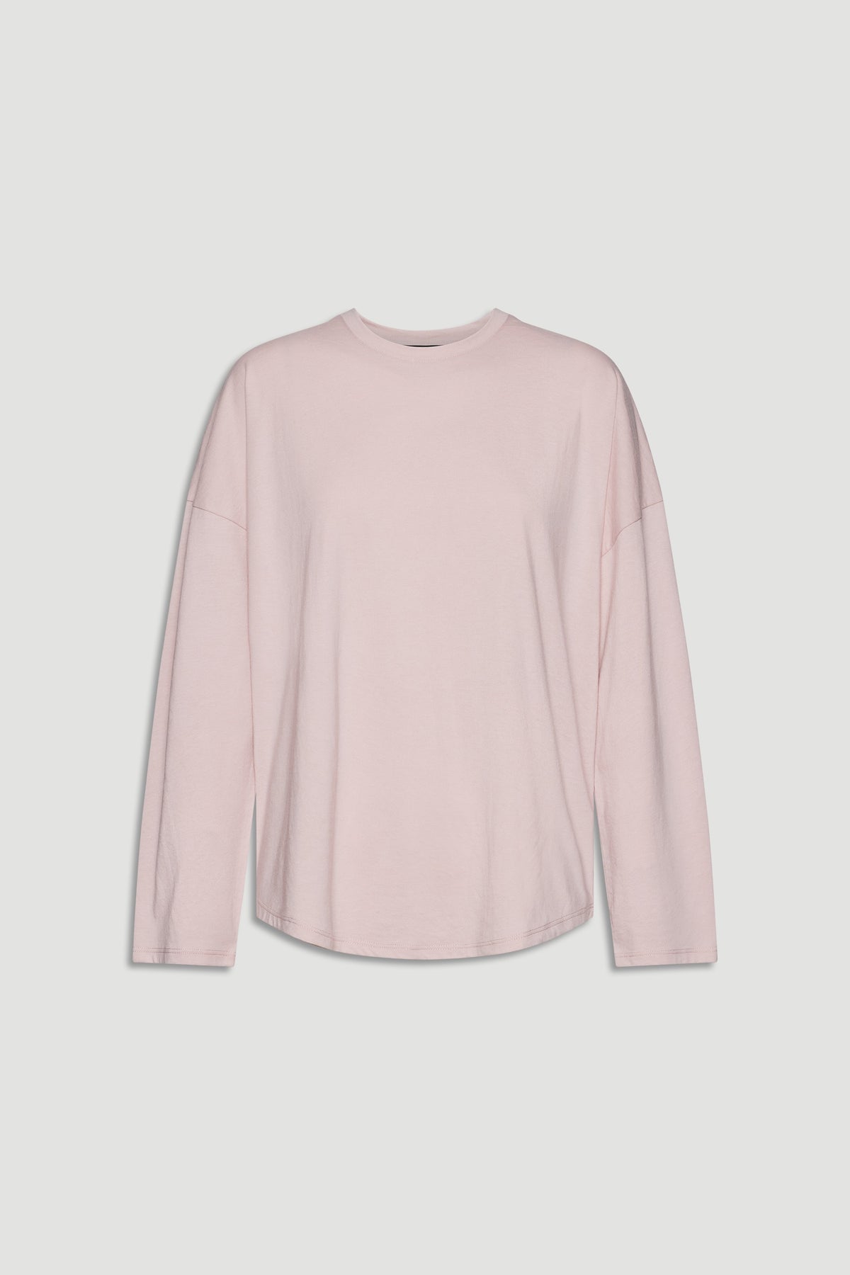 Soft pink long sleeve top with relaxed fit and crew neckline for casual, everyday wear.