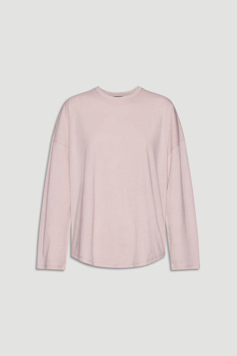 Soft pink long sleeve top with relaxed fit and crew neckline for casual, everyday wear.