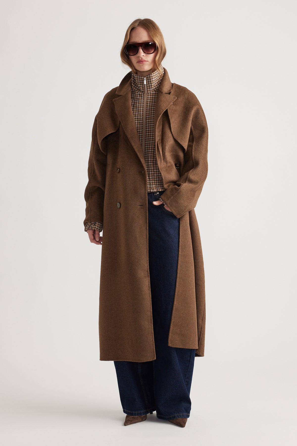 Woman wearing Lucia Felled Two Piece Coat in rich brown with double-breasted buttons and relaxed fit for a timeless layered style