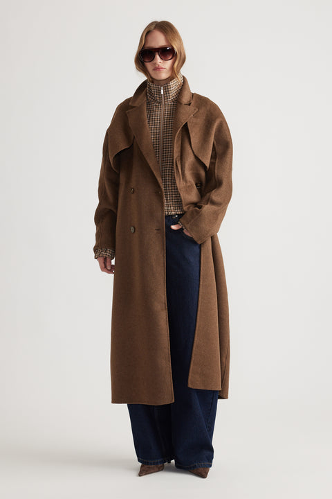 Woman wearing Lucia Felled Two Piece Coat in rich brown with double-breasted buttons and relaxed fit for a timeless layered style