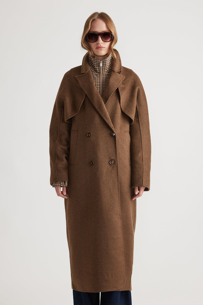 Woman wearing Lucia Felled Two Piece Coat in rich brown with double-breasted buttons and extended lapels for a chic layered look