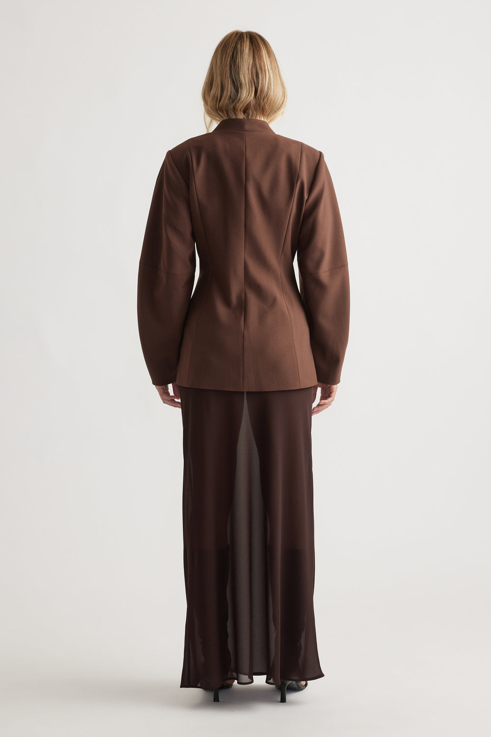 Back view of Ruby Barrel Sleeve Blazer in rich coffee brown paired with a flowing matching skirt for elegant layering.