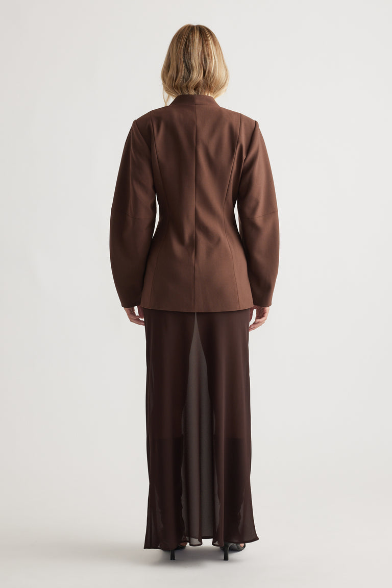 Back view of Ruby Barrel Sleeve Blazer in rich coffee brown paired with a flowing matching skirt for elegant layering.