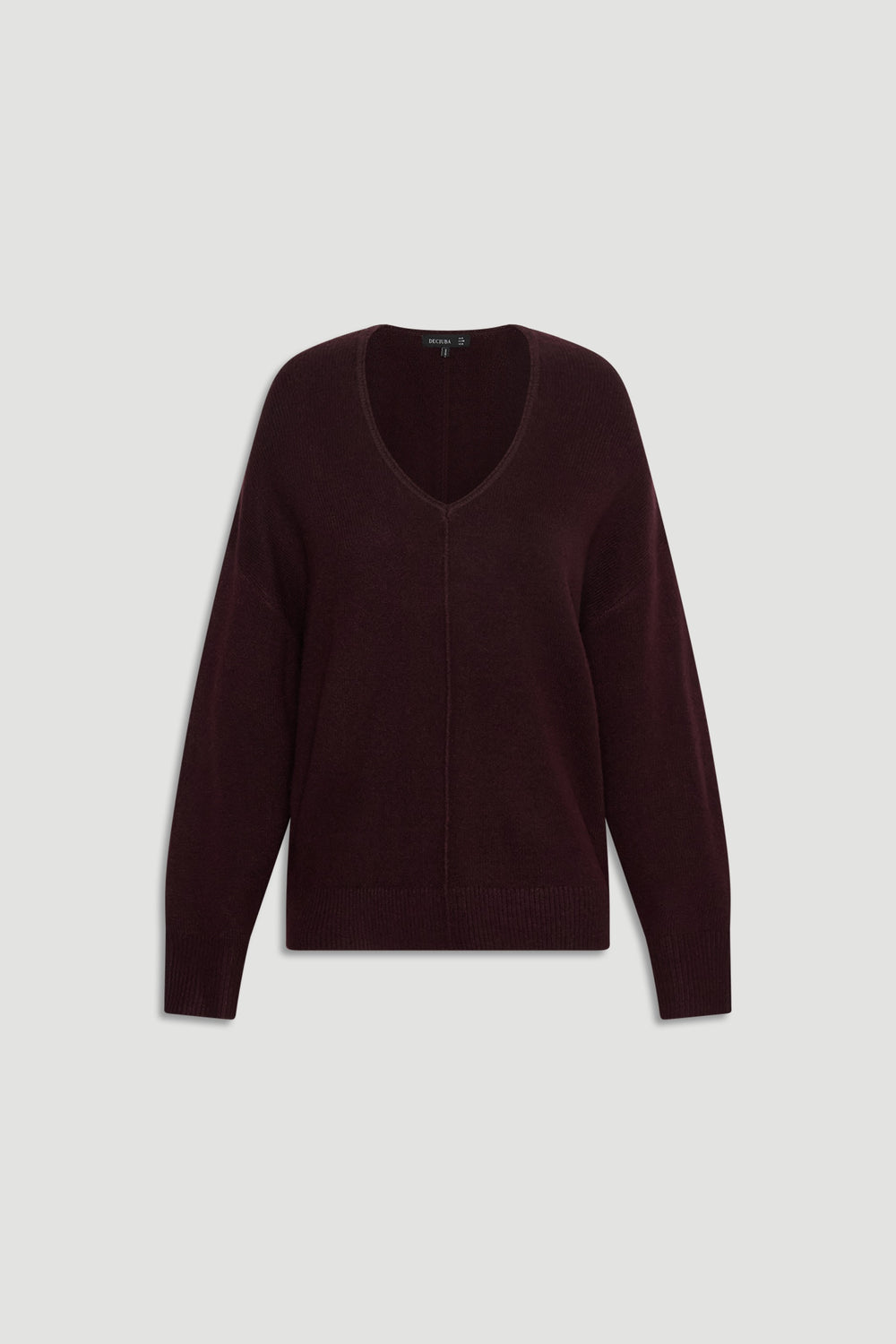 Soft burgundy knit jumper with V-neckline and subtle central seam detail for a relaxed, cozy fit.