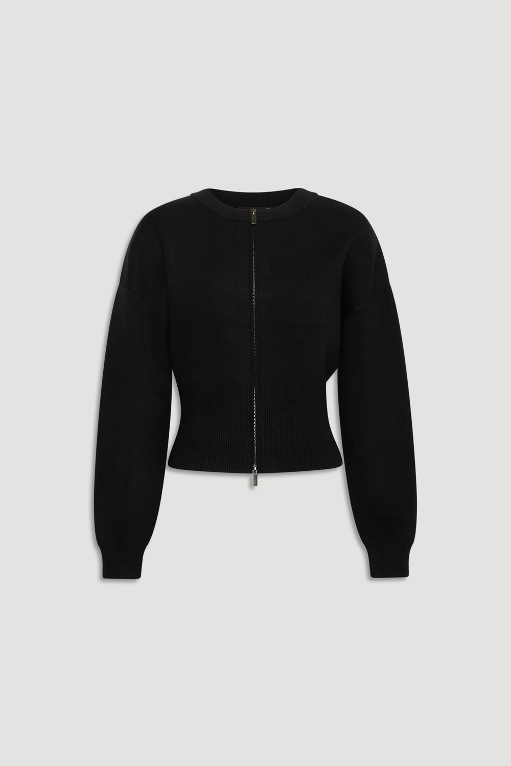Black knit bomber with a cropped fit, featuring a front zip closure and long balloon sleeves with ribbed cuffs and hem