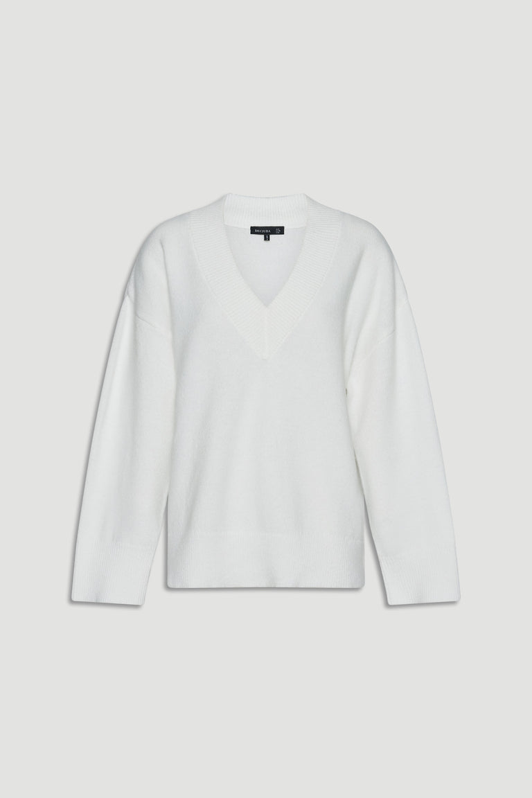 Soft white knit jumper with a relaxed fit and deep V-neck, designed for versatile everyday layering.