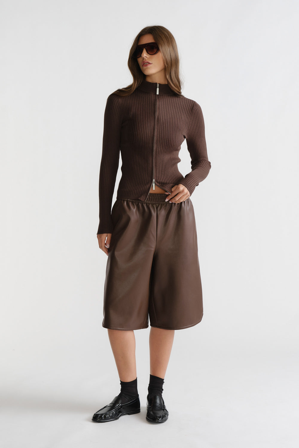 D-Luxe Faux Leather Bermuda in dark brown with a relaxed fit and elastic waistband, styled by DECJUBA Australian brand