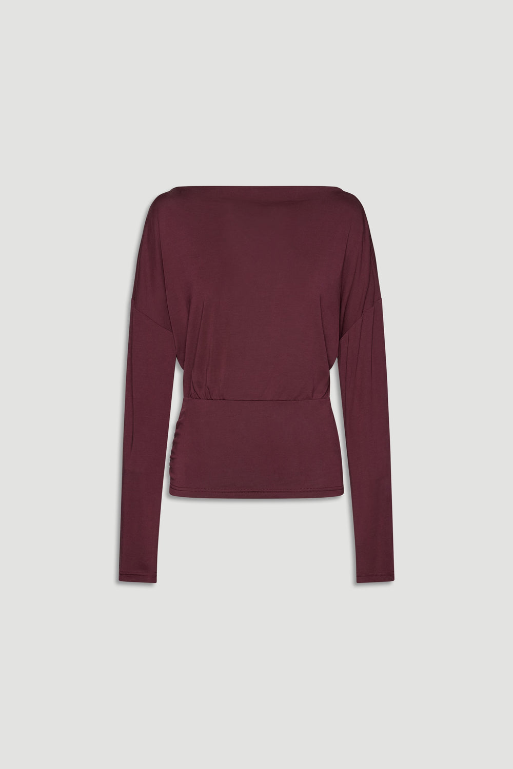 Plum-colored long sleeve top with a cinched waist, featuring a relaxed fit and soft drape for everyday elegance