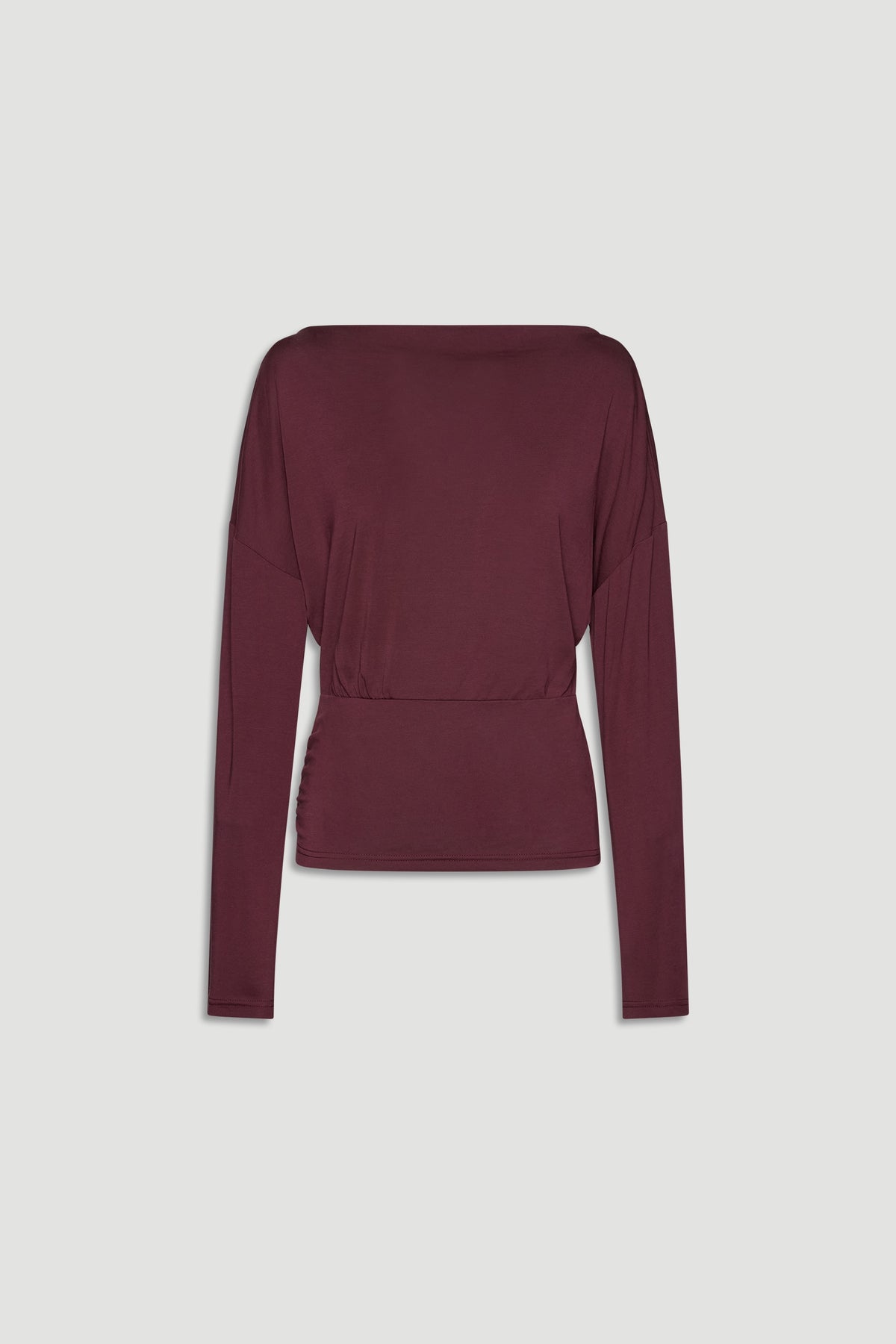 Plum-colored long sleeve top with a cinched waist, featuring a relaxed fit and soft drape for everyday elegance