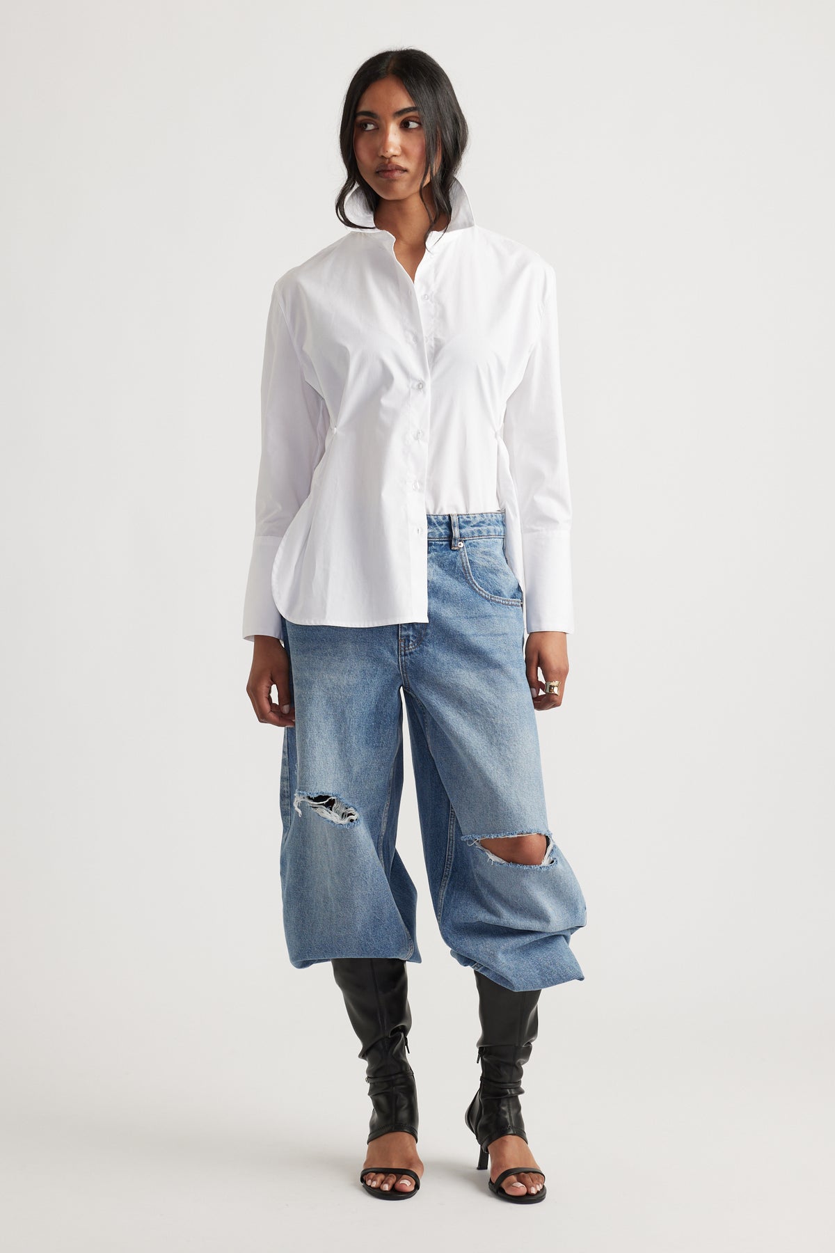 Kristy Side Button Shirt in crisp white cotton with long sleeves styled with oversized ripped denim jeans by DECJUBA Australian fashion brand