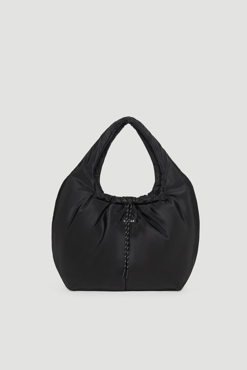 Black padded shoulder bag with soft texture and gathered detail at the center front for a modern look