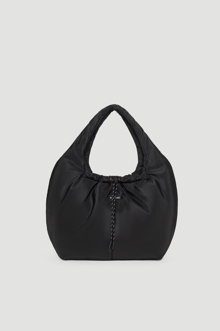 Black padded shoulder bag with soft texture and gathered detail at the center front for a modern look