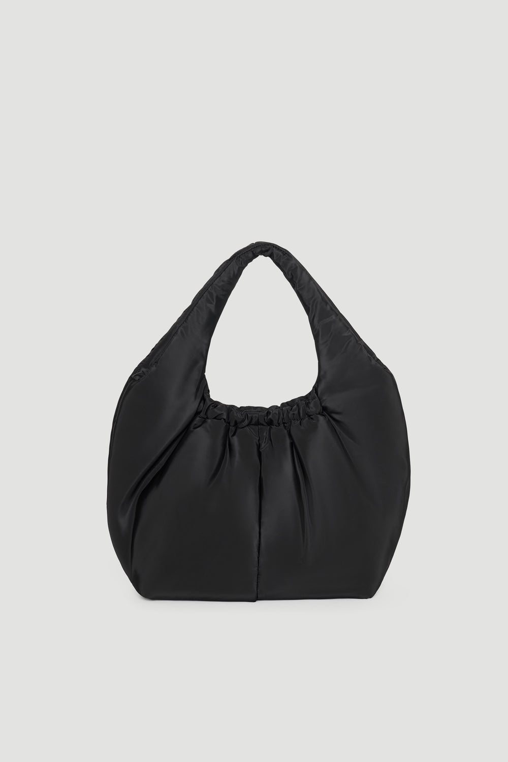 Soft black puffer bag with a slouchy silhouette and gathered detailing at the handle for a modern casual look