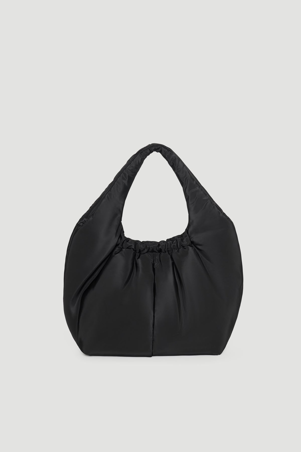 Soft black puffer bag with a slouchy silhouette and gathered detailing at the handle for a modern casual look