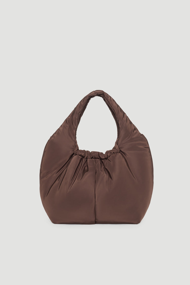 Chocolate brown puffer-style handbag with a soft, padded texture and gathered detail at the top handle.