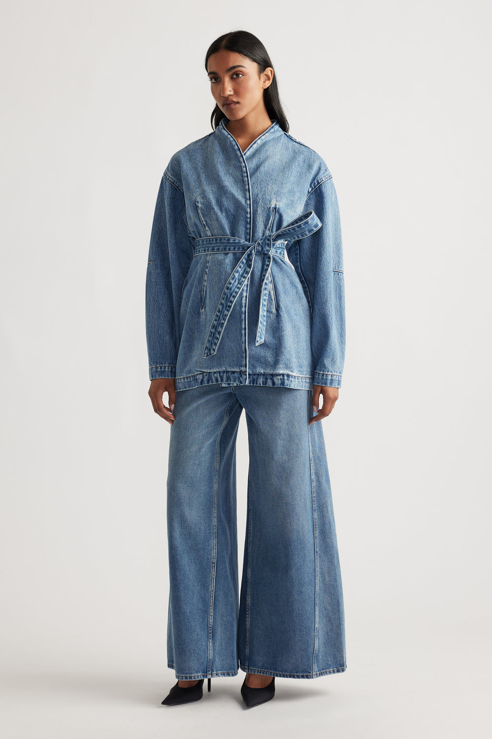 Front view of a woman wearing Kylie Denim Blazer Dress in blue with a belted waist and relaxed fit by DECJUBA