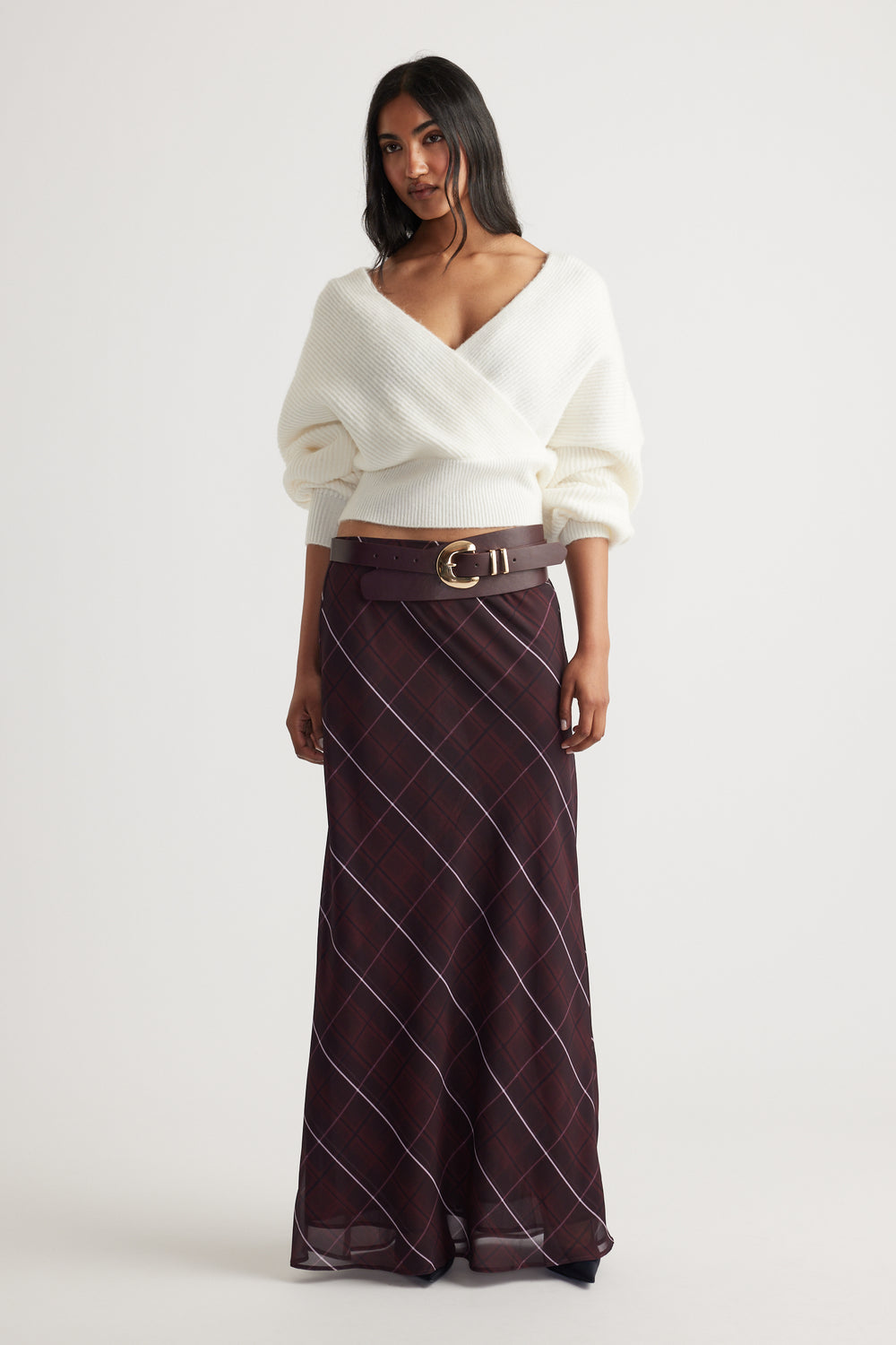 Harper Crossover Jumper in soft white knit with a flattering wrap design, styled with a plaid skirt by Decjuba Australian fashion brand