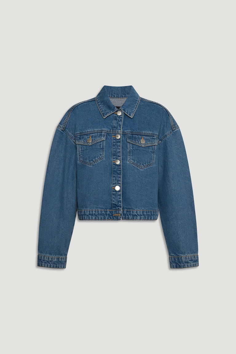 Mid-blue cropped denim jacket with button front, chest pockets, and classic collar for a casual layered look