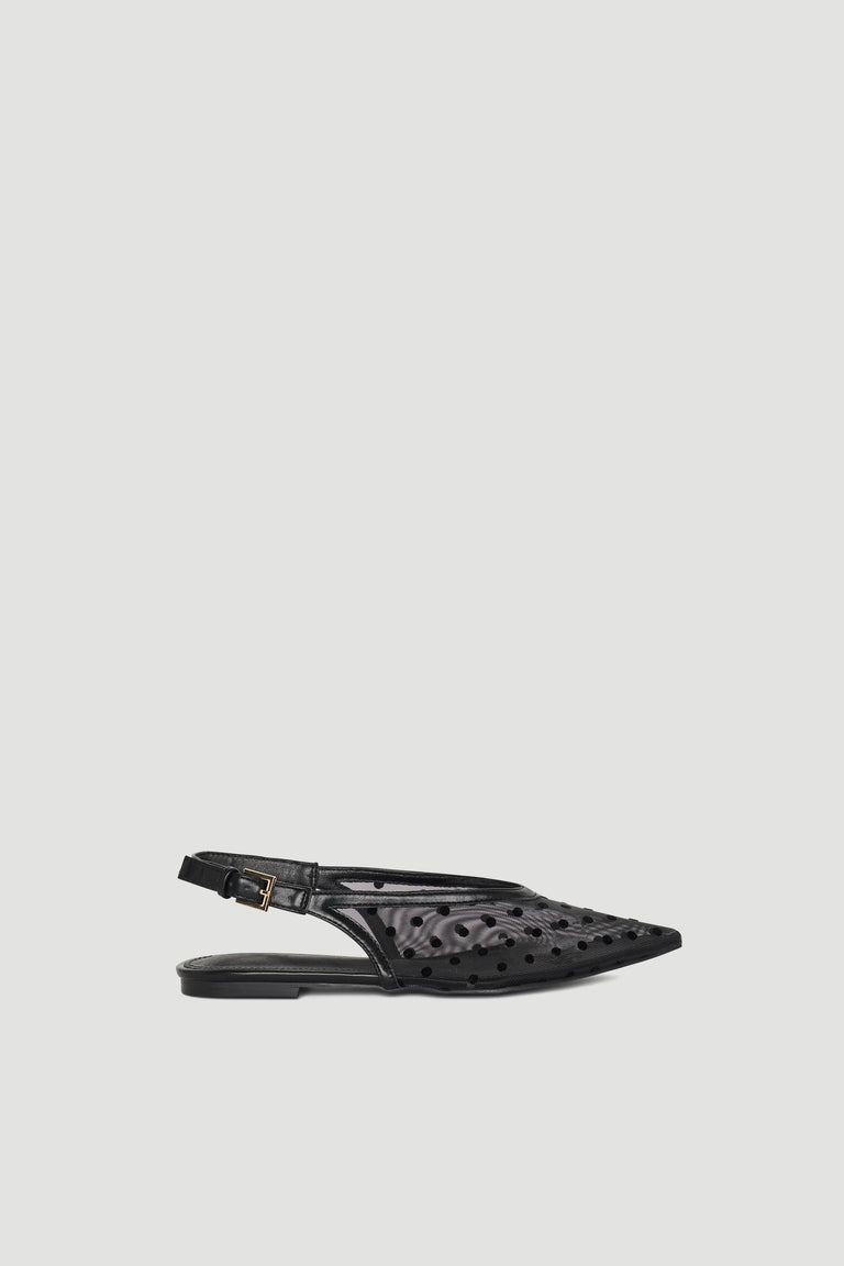Black pointed slingback shoe with polka dot mesh and adjustable buckle strap for chic, lightweight wear.