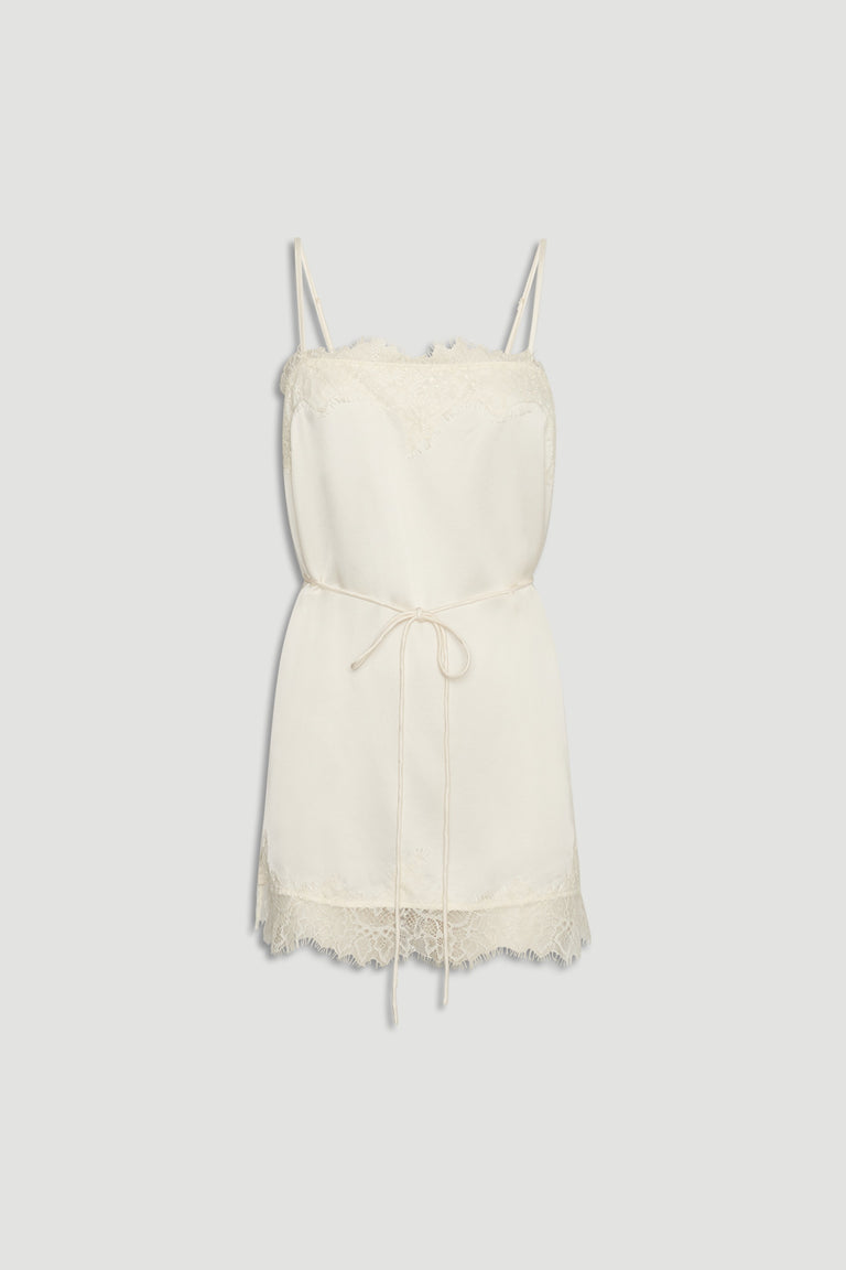 Ivory lace-trimmed slip cami with delicate straps and a thin waist tie for a soft, elegant silhouette